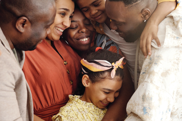 Group of people in a family hugging