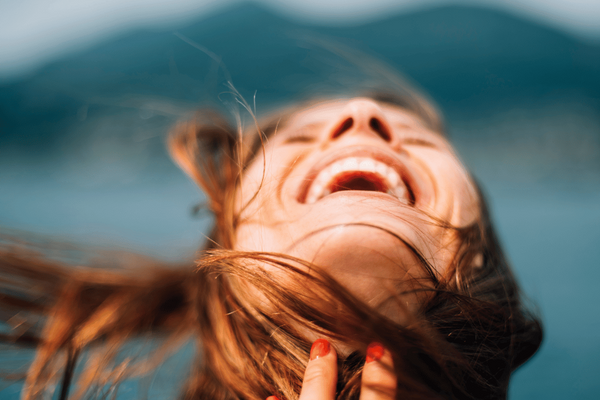 Happy woman in breeze