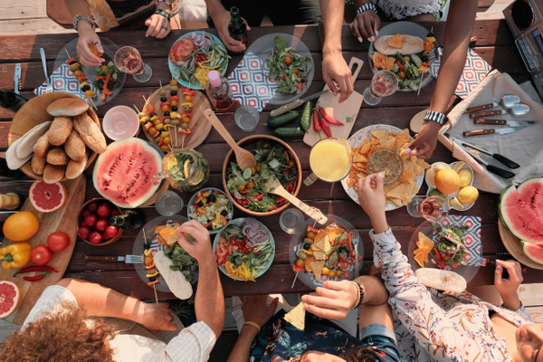 community eating food together at a table