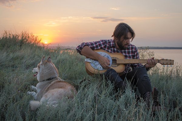 Pet Lover Playing Calming Music to Dog