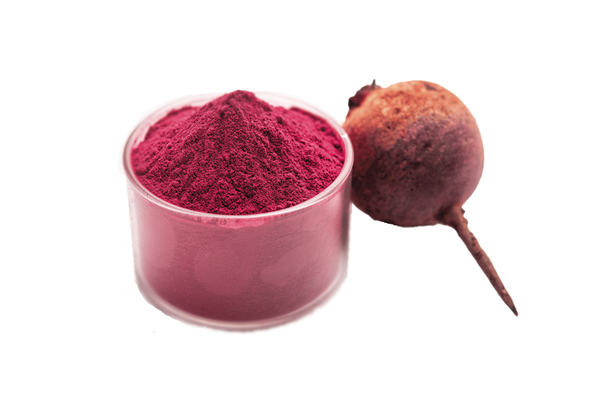 Container of beet root powder next to beet