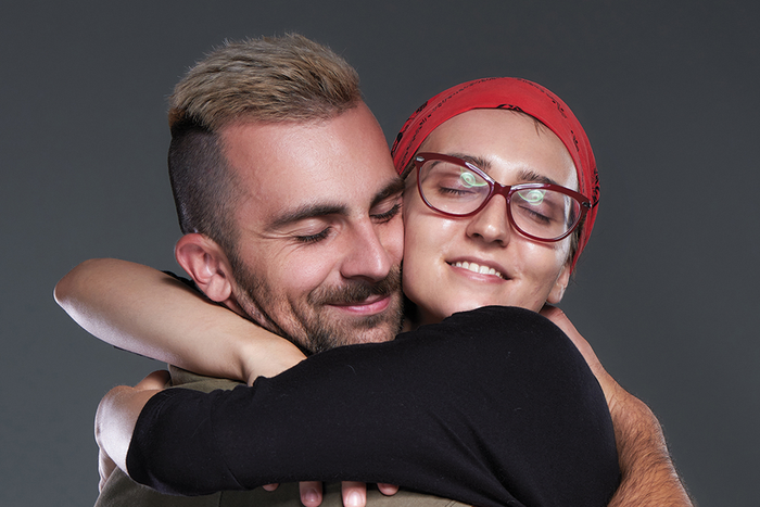 Men embracing each other in a hug