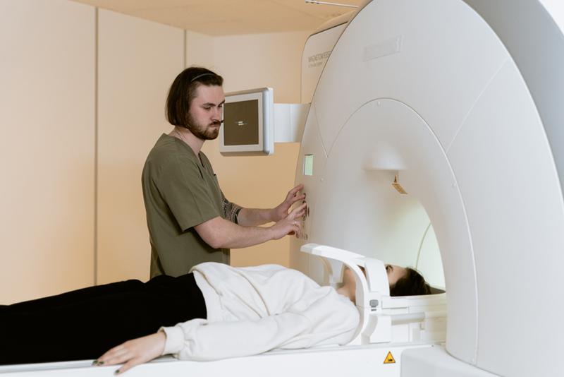 Medical professional using MRI machine on patient